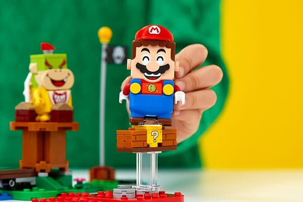Mario looks so happy in LEGO form, if only he knew he was hackable. Courtesy of Nintendo.