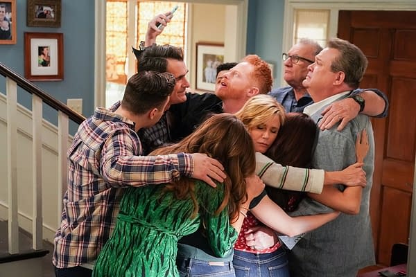 Phil, Mitch, Cam, Claire, Jay, Gloria, and the rest of the family gather for a group hug selfie on Modern Family, courtesy of ABC.