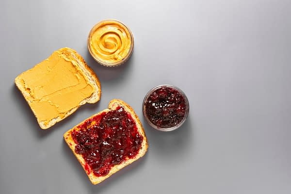 Sandwiches or bread toast with peanut butter and fruit jelly. Flat lay. By Erhan Inga