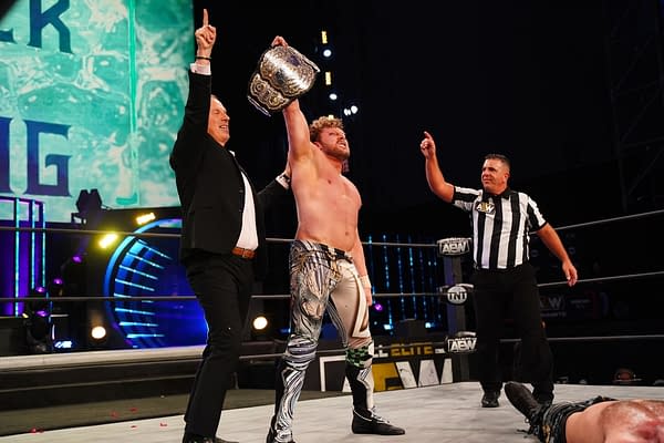 Kenny Omega stands tall with Don Callis after winning the AEW Championship, just as AWE Dynamite won the Wednesday Night Ratings Wars this week (Credit: All Elite Wrestling)