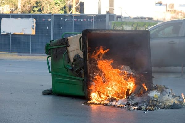 The Official Graphic of The Week in Comics. Fire in a Garbage Bin, photo credit: konstantinos69/shutterstock.com.