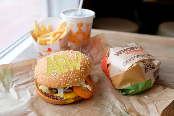 An artist's recreation of Tony Khan's alleged condiment caper, based on Image: Bangkok, Thailand - July 9, 2018 : Close up of a Burger King Whopper with cheese burgers, fries and soft drink served at a store at Sala Daeng (Shutterstock.com/Terence Toh Chin Eng)