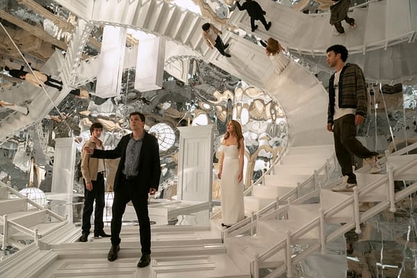 Scene from the film 'Now You See Me: Now You Don't' featuring characters Bosco, Daniel Atlas, Henley Reeves, and Charlie in a surreal, mirror-filled environment with twisting white staircases and bright light fixtures.