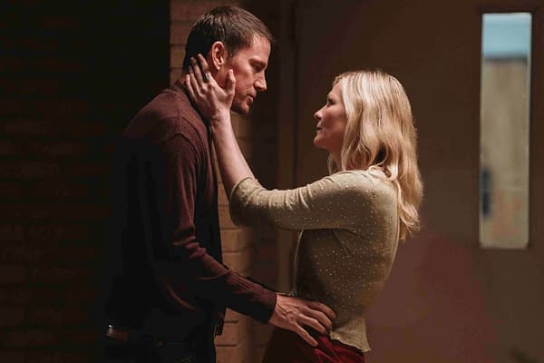 Channing Tatum and Kirsten Dunst share an intimate moment in a scene from the movie "Roofman," set against a softly lit background.