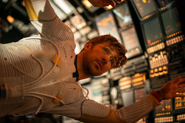 Project Hail Mary Ryan Gosling portrays Ryland Grace in a scene from the film 'Project Hail Mary,' featuring him in a futuristic suit against a backdrop of high-tech control panels.