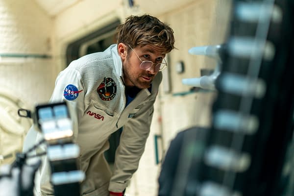 Ryan Gosling portrays Ryland Grace in a scene from the film 'Project Hail Mary', set on a spacecraft interior, wearing a NASA suit with glasses and an intent expression.