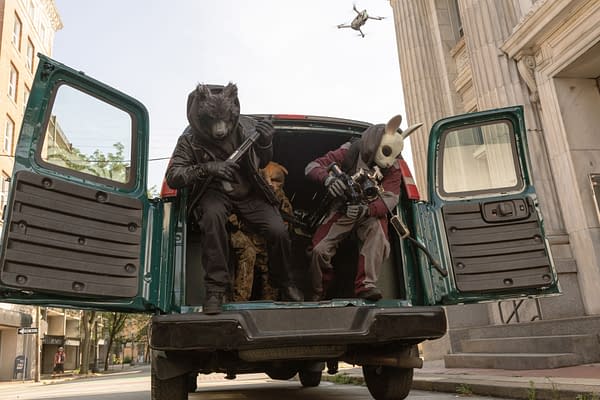 Three masked men in a van with its rear doors open, preparing for a heist in a city street scene from How to Rob a Bank.
