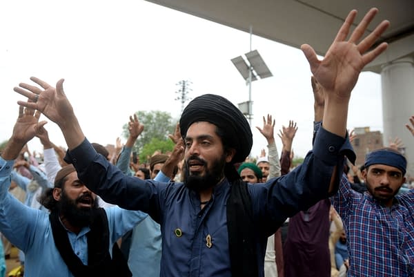 Supporters of the Tehreek-e-Labaik Pakistan (TLP) Islamist political party chant slogans as they protest against the arrest of their leader in Lahore, Pakistan April 16, 2021, photo credit: A M Syed / Shutterstock.com.