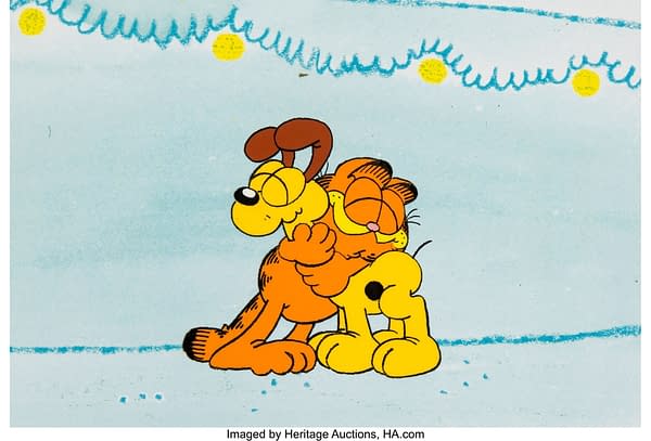 A Garfield Christmas Special Garfield and Odie Hug Production Cel (Film Roman, 1987). Credit: Jim Davis Collection