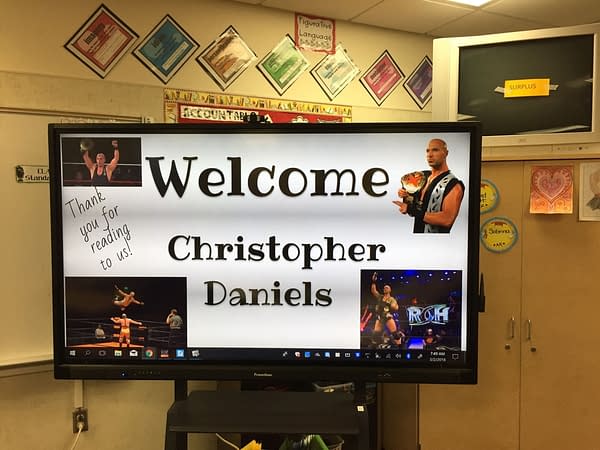 Christopher Daniels read to kids