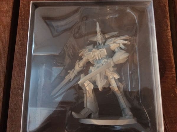 The Cyclopsis deluxe figure for Renegade's Power Rangers: Heroes of the Grid, in its box behind plastic. It is definitely larger and more dynamic than the original Megazord figure.