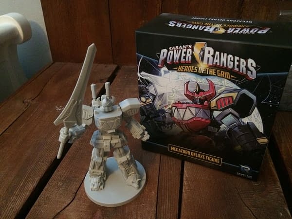 The Megazord deluxe figure from Power Rangers: Heroes of the Grid, out of its box and with Power Sword in hand.