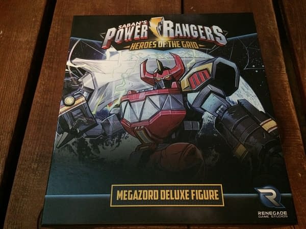 The front lid of the box for Renegade Game Studios' Megazord deluxe figure for the Power Rangers: Heroes of the Grid board game.