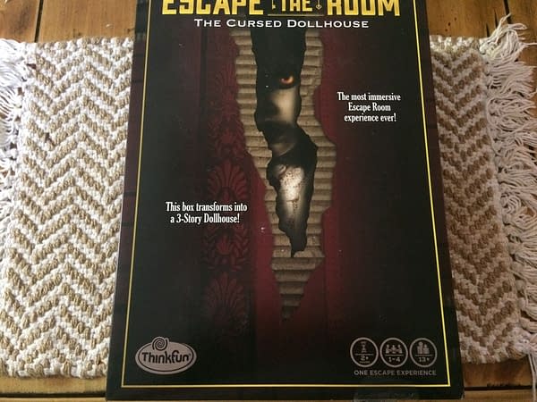 The front lid of the box for Escape The Room: The Cursed Dollhouse by ThinkFun Inc., out this Fall!
