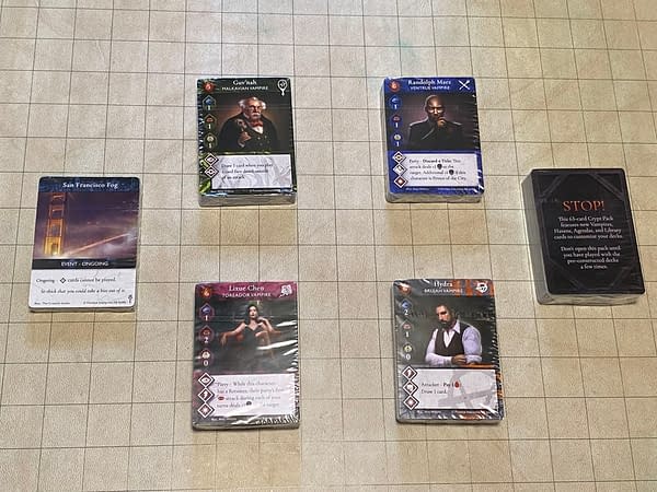 Four preconstructed House-themed decks, and a few more clusters of card components for Vampire: The Masquerade Rivals, a card game by Renegade Game Studios.