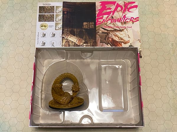 An array of the contents within Epic Encounters' latest module boxed set, "Temple of the Snake God", by Steamforged Games.