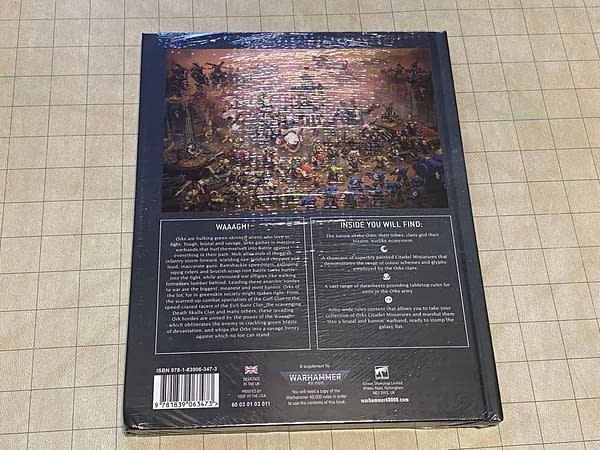 The back cover of the Orks codex from the latest edition of Warhammer 40k, the quintessential grimdark sci-fi tabletop wargame by Games Workshop.