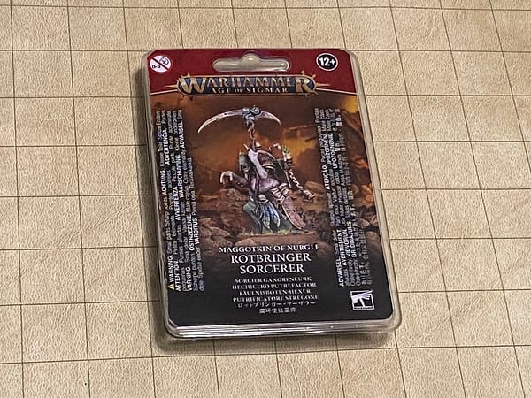 The front of the blister pack (if you could mind the pun) for the Rotbringer Sorcerer, the one new model in the Maggotkin of Nurgle line from Age of Sigmar by Games Workshop.