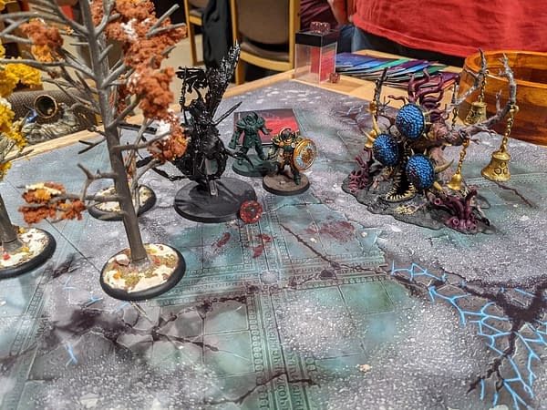 A poor, lone Plague Drone being beset upon by a couple of Stormcast Annihilators during the first game of a Path to Glory campaign for Age of Sigmar, a tabletop wargame by Games Workshop. Photo credit: Frank Femia.