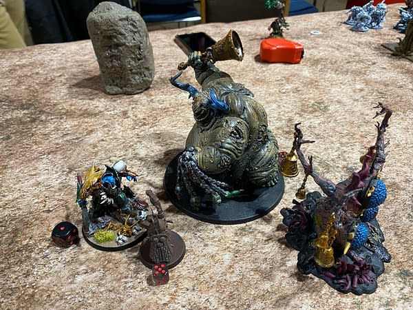 Daisy shows the other Maggotkin of Nurgle how to properly slay a warlord. Photo credit: Josh Nelson, for a Path to Glory campaign for Age of Sigmar, a fantasy wargame by Games Workshop.