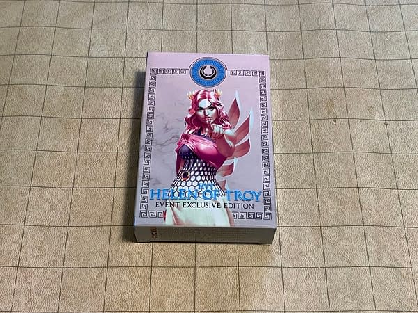 The front face of the box for Helen of Troy, a new promotional miniature for Infinity CodeOne, a game by Corvus Belli.