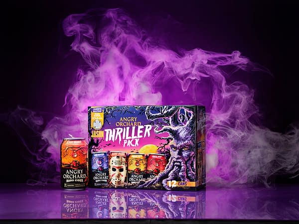 A vibrant box of Angry Orchard's Thriller Pack featuring twelve cans, prominently displaying a blood orange can design. Behind it, a spooky purple and smoke background adds a dramatic effect.