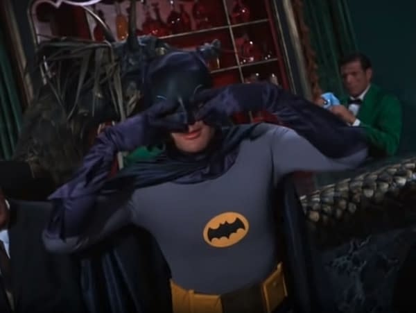 Batman performs his signature dance, The Batusi, while listening to Midnights by Taylor Swift