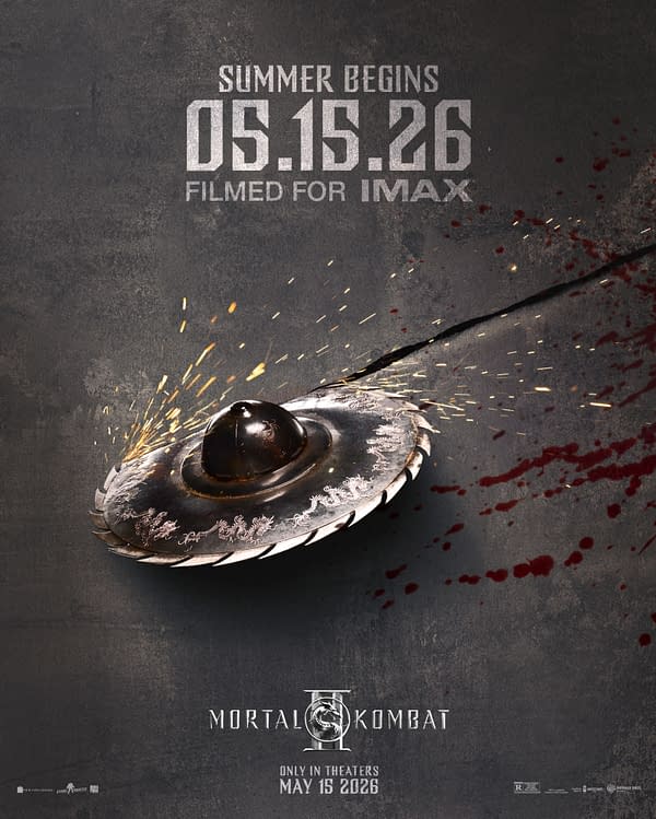 A promotional poster for 'Mortal Kombat II' featuring a metallic spinning blade with a glossy surface, surrounded by splatters of blood and explosive sparks. The text indicates a release date of May 15, 2026, and that it was filmed for IMAX.