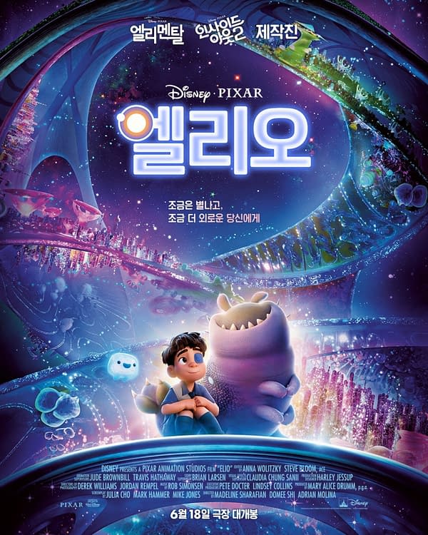 A colorful promotional poster for the Pixar film "Elio," featuring a young boy gazing up in awe beside a friendly monster amidst a vibrant, cosmic background filled with swirling colors and shapes.