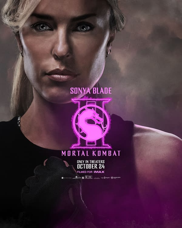 A promotional illustration for 'Mortal Kombat II' featuring the character Sonya Blade, who has a determined expression and is wearing a black outfit. The image includes the game's logo and release information, with a dramatic background highlighted by pink accents.