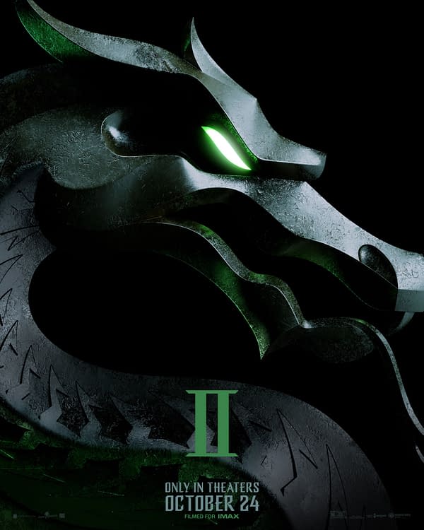 A stylized logo featuring a dragon's head, with glowing green eyes, representing the video game franchise Mortal Kombat II. The design is sleek and dark, with the number 'II' prominently displayed at the bottom, along with the text "Only in theaters October 24, filmed for IMAX."