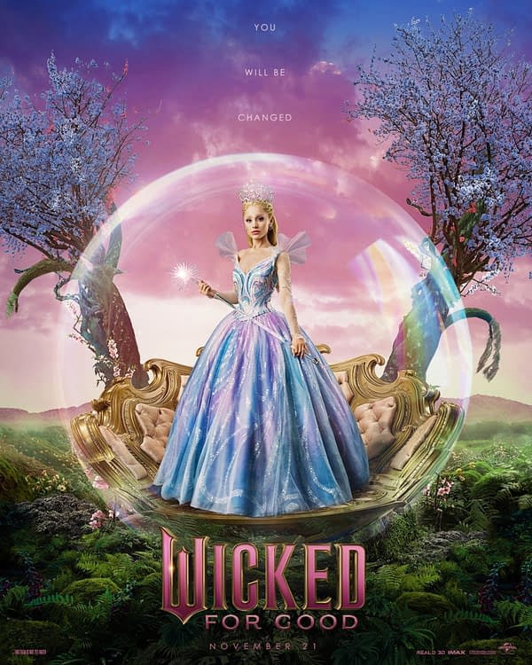 A promotional poster for the musical 'Wicked For Good,' featuring a character in a sparkling, blue and pink gown holding a wand, surrounded by a magical bubble. The background includes whimsical trees and colorful clouds, with the text 'YOU WILL BE CHANGED' and the release date 'NOVEMBER 21' prominently displayed.