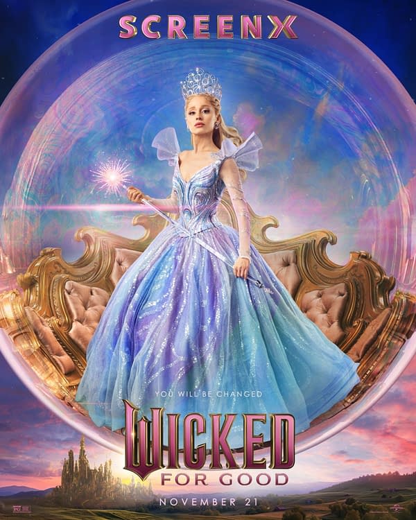 A whimsical illustration featuring a character in a sparkling, blue ball gown, adorned with a tiara and holding a magic wand, set against a colorful, ethereal background. The text 'WICKED FOR GOOD' is prominently displayed at the bottom, along with the date 'NOVEMBER 21.'