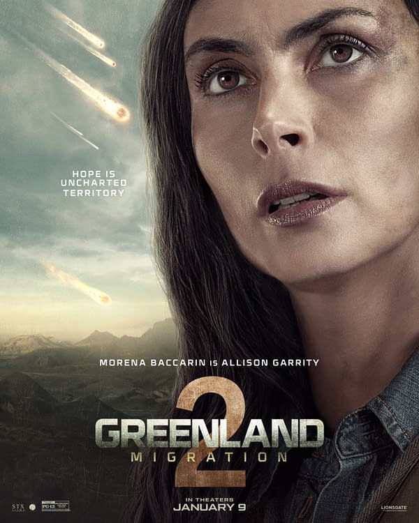 A promotional poster for the movie 'Greenland 2: Migration,' featuring a close-up of a distressed woman with long dark hair, facing upwards against a dramatic sky filled with meteors. Text on the poster includes the tagline 'Hope is uncharted territory' and credits the actress Morena Baccarin as Allison Garrity.