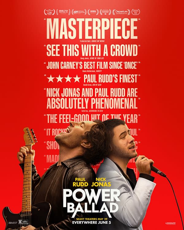 Movie poster for Power Ballad on a bright red background, showing Paul Rudd and Nick Jonas back-to-back, one holding a guitar and the other singing into a microphone, with large review quotes above.