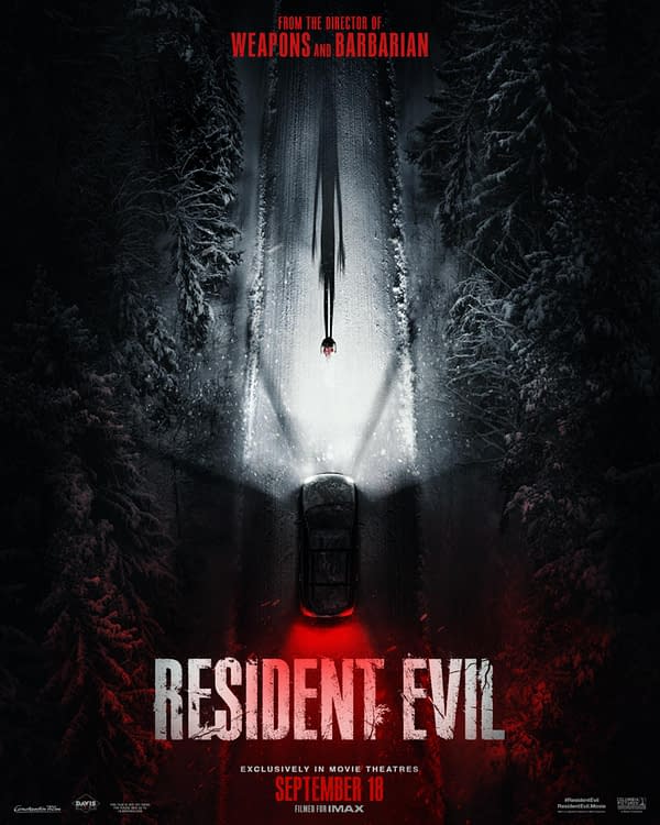 Dark Resident Evil movie poster showing a car driving through a snowy forest at night, with eerie red and white lighting and a looming figure in the road.