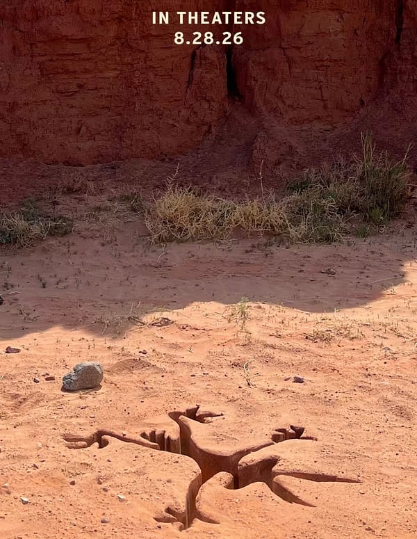 A cracked, reddish desert ground with sparse vegetation and a small rock, featuring text that reads 'IN THEATERS 8.28.26.' This visual is associated with the upcoming release of 'Coyote vs. Acme'.