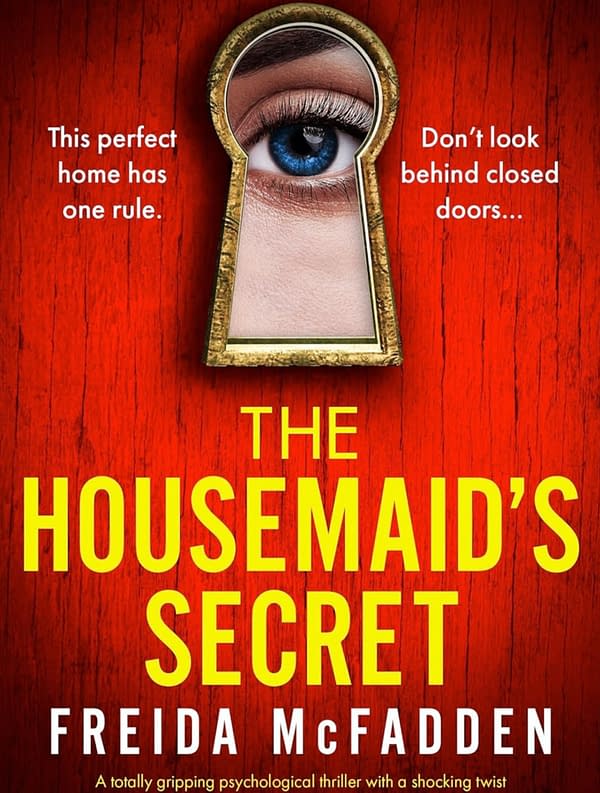 Cover design for 'The Housemaid's Secret' by Frieda McFadden, featuring a golden keyhole with a blue eye peering through, set against a red wooden background. Text warns, "This perfect home has one rule" and, "Don't look behind closed doors...".