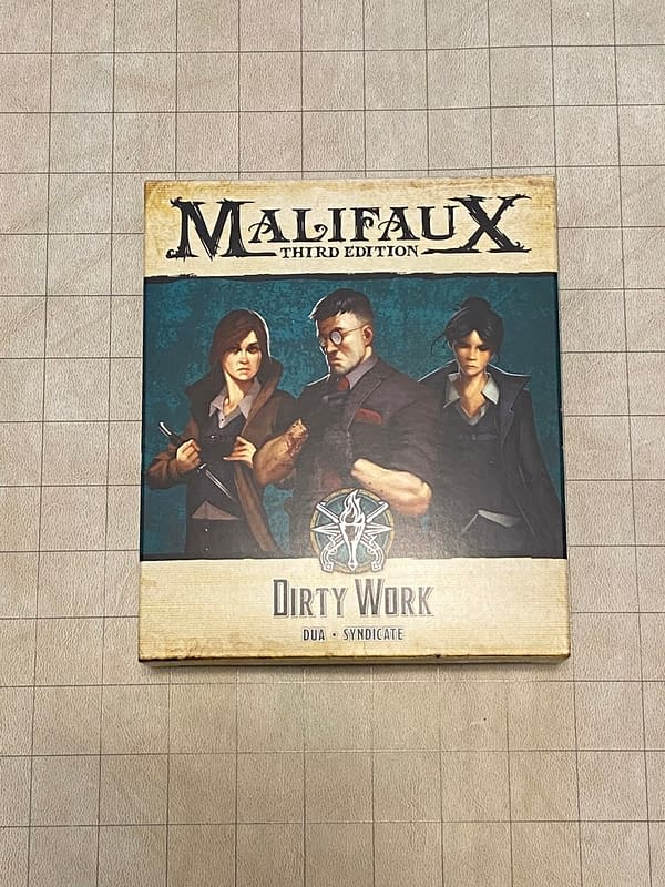 The front of the Dirty Work boxed set's packaging for Wyrd Miniatures' skirmish game, Malifaux.