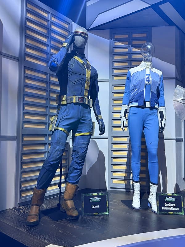 Avengers: Doomsday display at SDCC with Cyclops and Sue Storm Invisible Woman costumes standing on a futuristic set.