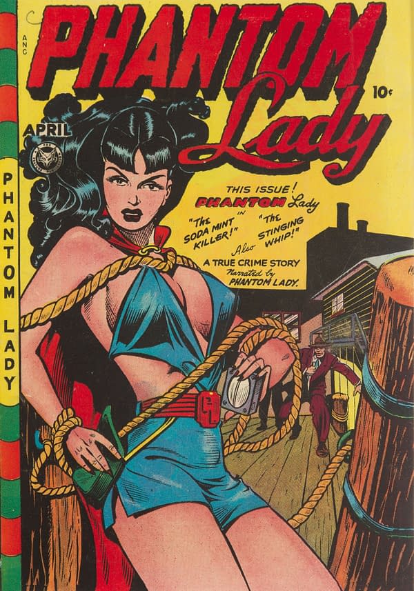 A vintage comic book cover featuring Phantom Lady, a female superhero, in a revealing costume. She is tied with ropes and displays a confident expression, while a man in a suit is seen in the background.