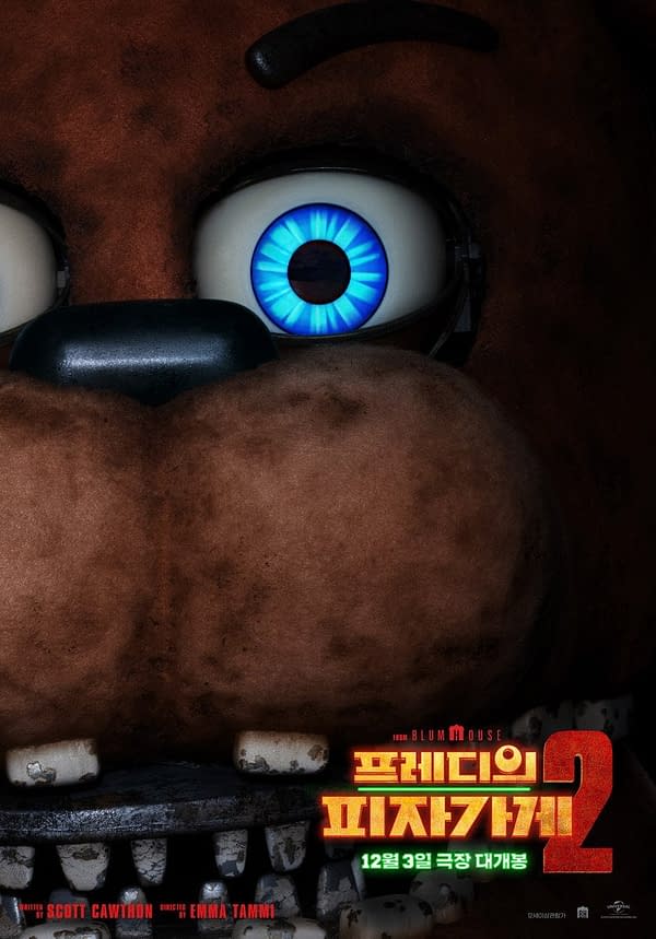 A menacing cartoon character head from 'Five Nights at Freddy's 2,' featuring large, expressive blue eyes and a furry brown exterior, with an open mouth showing sharp teeth. The image includes stylized text indicating the film's title and release date.