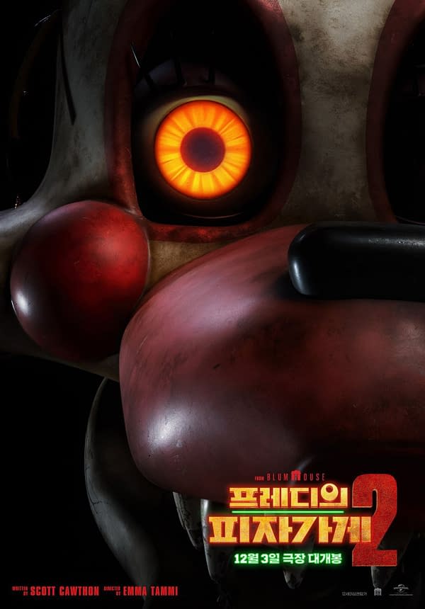 A close-up illustration of a character from Five Nights at Freddy's 2, featuring a menacing teddy bear-like face with an orange glowing eye. The promotional text below the character announces the film's release date and credits the creators.