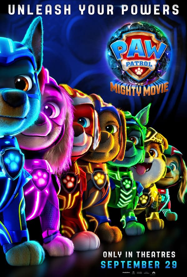 A colorful illustration featuring the main characters from "Paw Patrol: The Mighty Movie," all wearing vibrant superhero uniforms in various colors. The logo for the movie is prominently displayed above the characters, with the text "Unleash Your Powers" at the top and the release date "September 29" at the bottom.