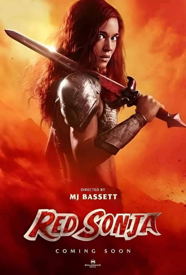 A promotional poster for 'Red Sonja' featuring a fierce warrior with long red hair, holding a sword over her shoulder against a dramatic orange background. The text at the bottom reads 'Directed by MJ Bassett' and 'COMING SOON'.