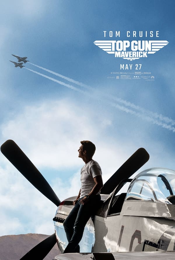 A promotional poster for 'Top Gun: Maverick' featuring a man in a white shirt sitting on the wing of an aircraft, gazing up at two fighter jets flying in the sky. The film title and release date are displayed at the top.