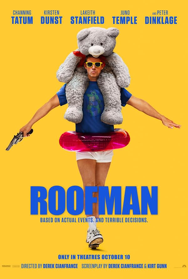 A humorous movie poster for "Roofman" featuring a man in a blue shirt and white shorts, holding a toy gun in one hand and wearing sunglasses. He has a large stuffed bear on his shoulders and is standing in front of a vibrant yellow background. The title "ROOFMAN" is boldly displayed at the bottom, along with the tagline about the film being based on actual events.