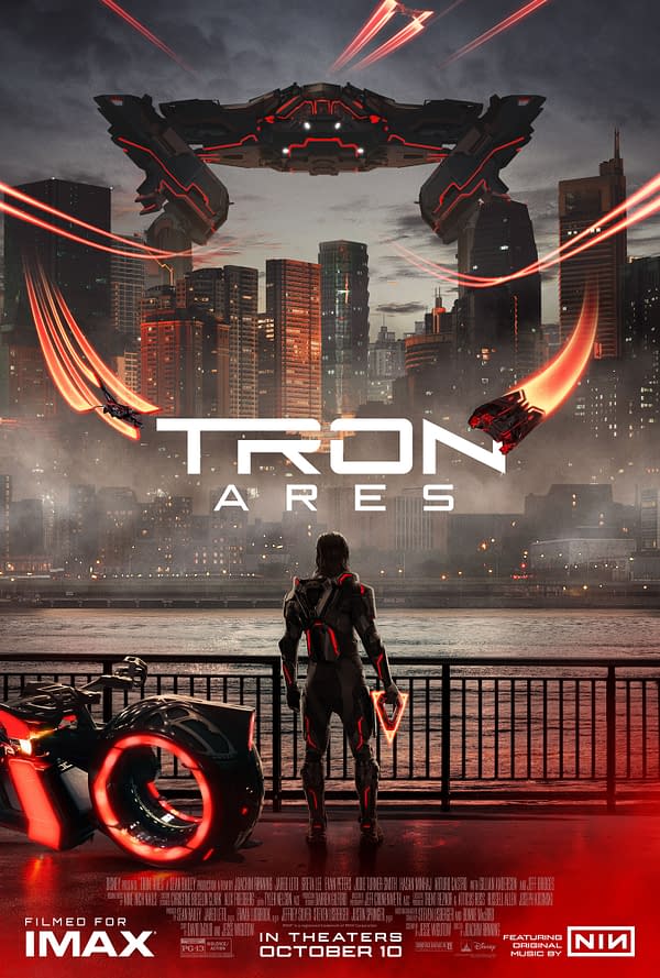 A digital illustration for 'TRON: Ares' featuring a futuristic character in a glowing black and red outfit, standing by a waterfront at night and facing a skyline illuminated by city lights. In the background, a large hovering ship and red streaks suggest high-speed action, while a motorcycle with a circular glowing wheel is positioned beside the character.