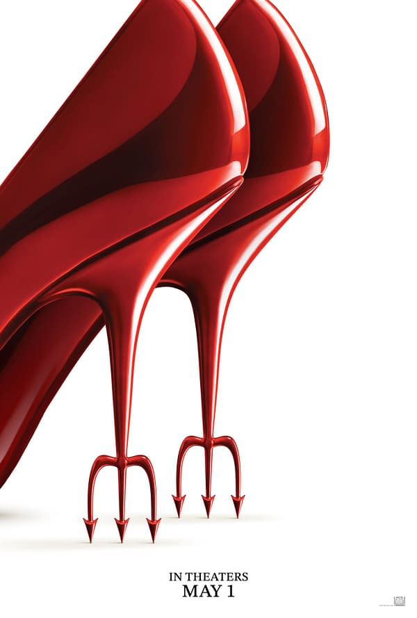A promotional poster for 'The Devil Wears Prada 2', featuring a pair of stylish red high-heeled shoes with a devilish trident motif on the heel, suggesting fashion with a touch of mischief. The text at the bottom announces the movie's theatrical release date as May 1.