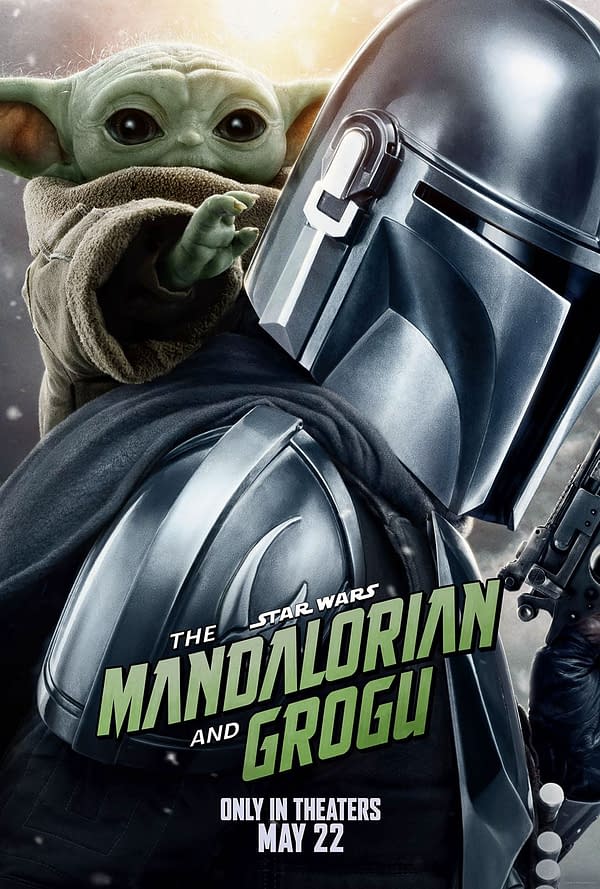 A poster featuring The Mandalorian, a character in reflective armor, holding Grogu, a small green figure with large eyes, who is reaching out with one hand. The title 'THE MANDALORIAN AND GROGU' is prominently displayed in stylized text, with a theatrical release date of May 22 below.